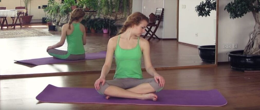 A girl does physiotherapy to treat cervical osteochondrosis.